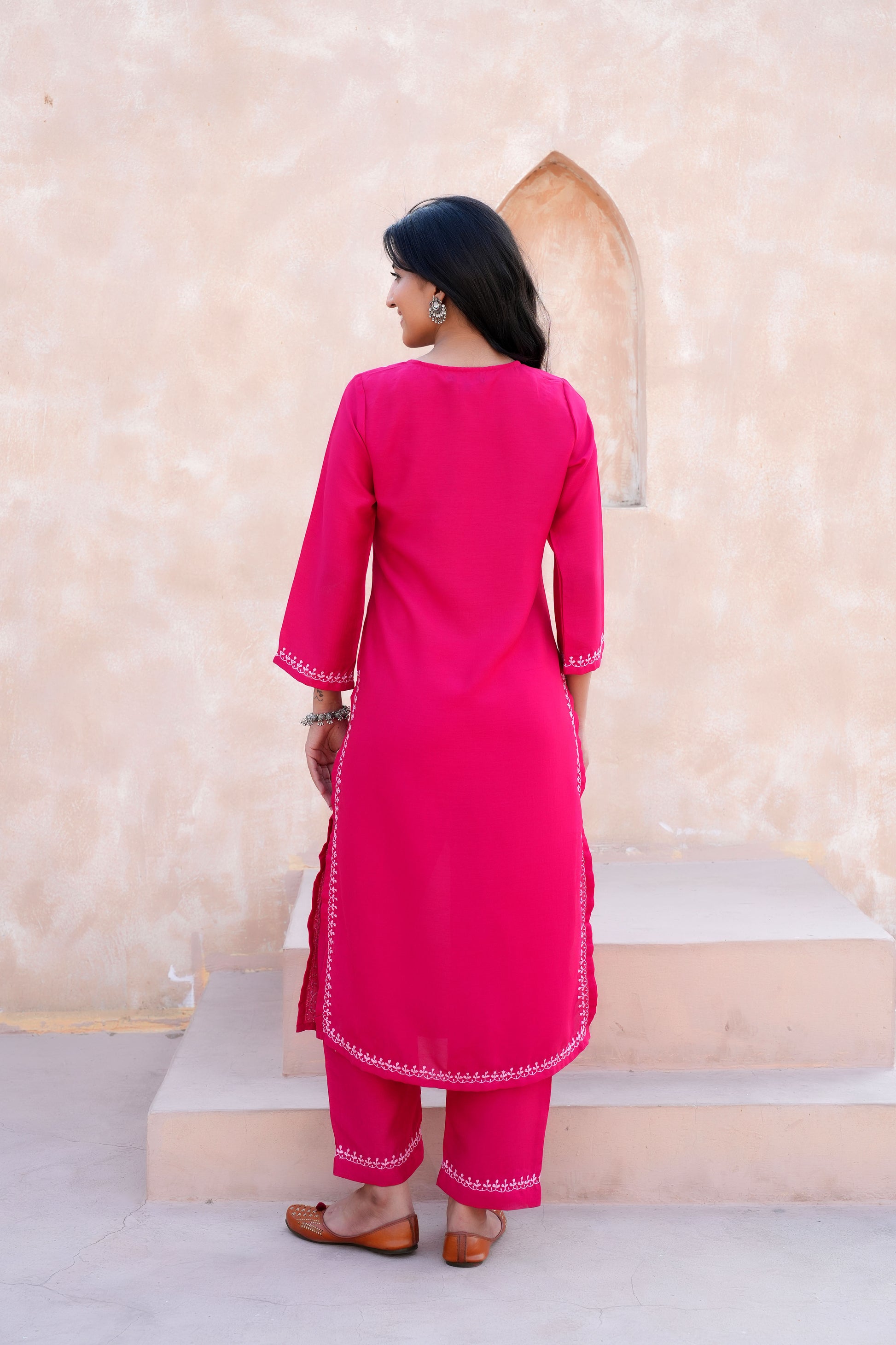 Intricate floral embroidery on front, back and sleeves
