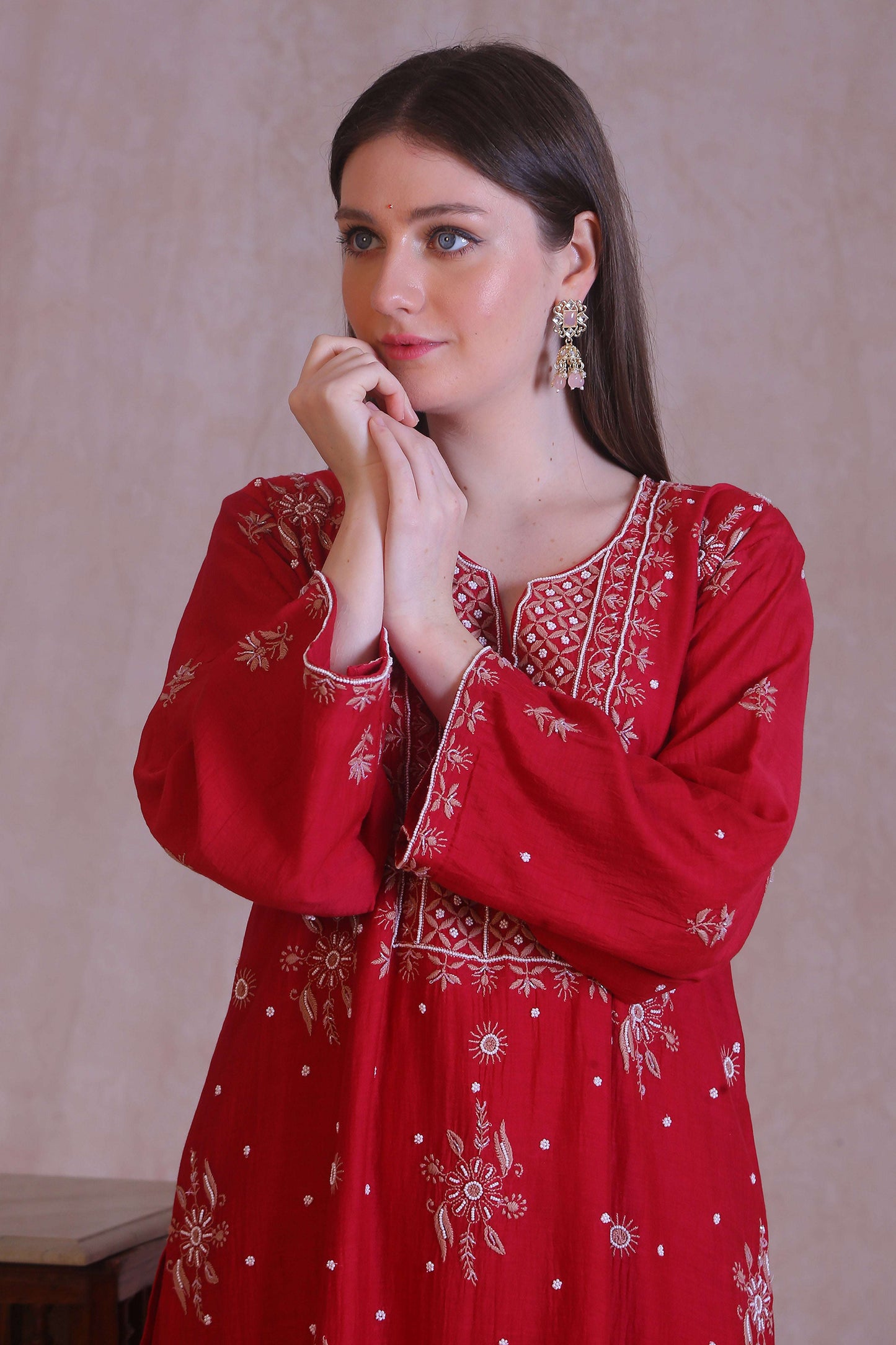 embroidery with moti and cutdana work on contrasting beige thread