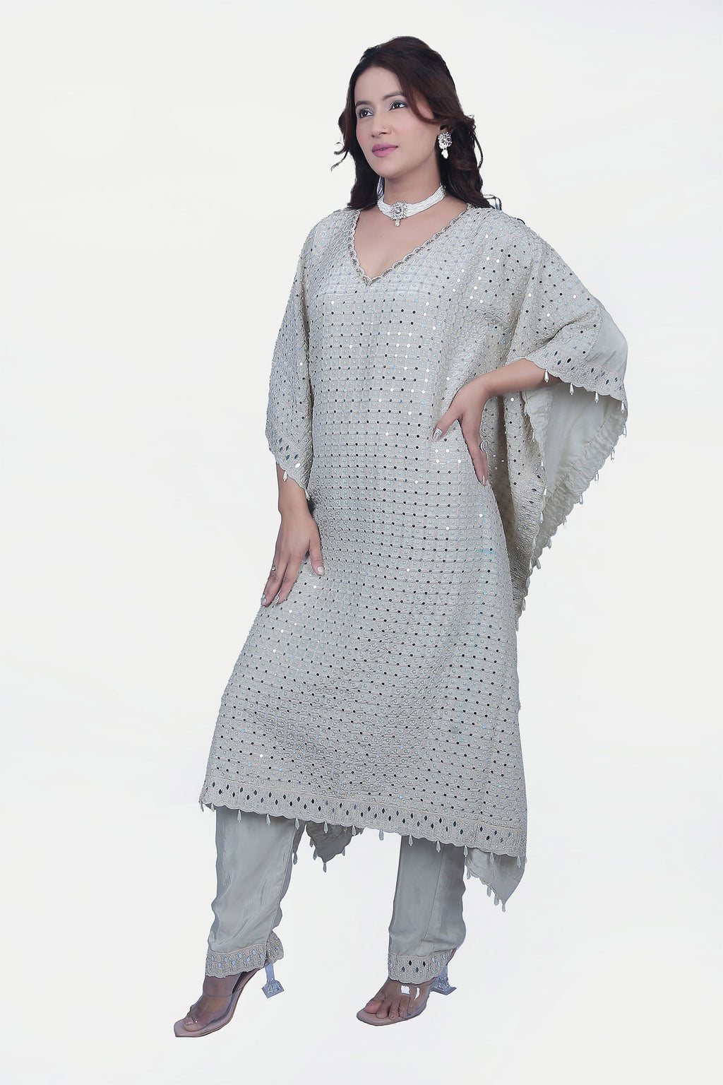 This fully embellished kaftan set is one of the go to styles that is ready to wear with matching pants.