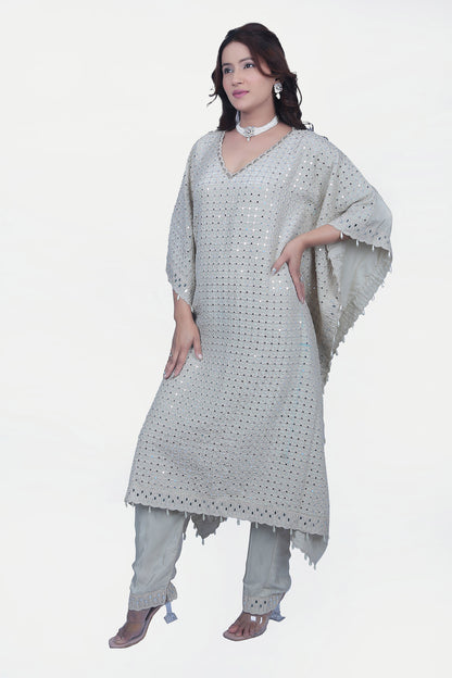 This fully embellished kaftan set is one of the go to styles that is ready to wear with matching pants.