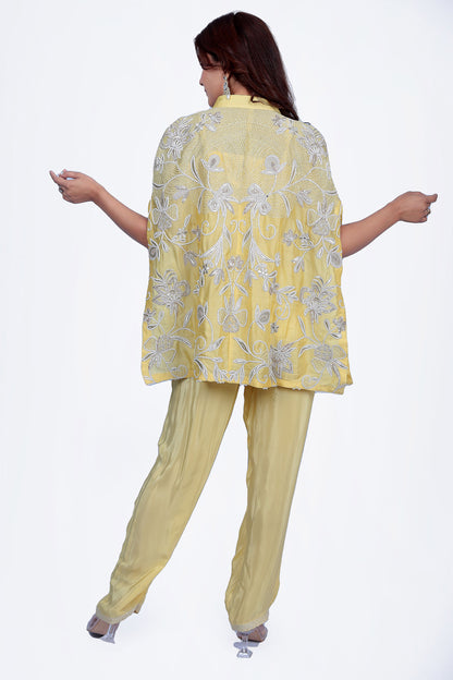 Intricate floral embroidery on front, back and sleeves.