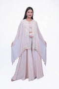 This peach colored fabric palazzo/sharara set features a stunning design