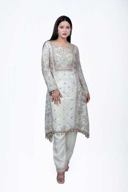 This kurta set is made out of pure silk fabric with zari work all over the seams and borders.