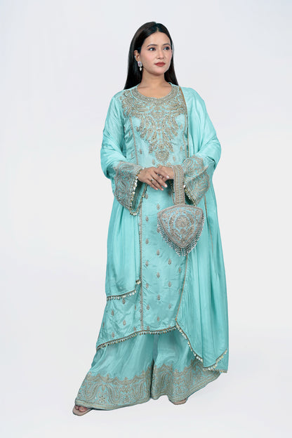 Kurta set  with beautiful heavy ornamented potli. Pearl work with surface embellishement makes it a favourite choice of everyone.