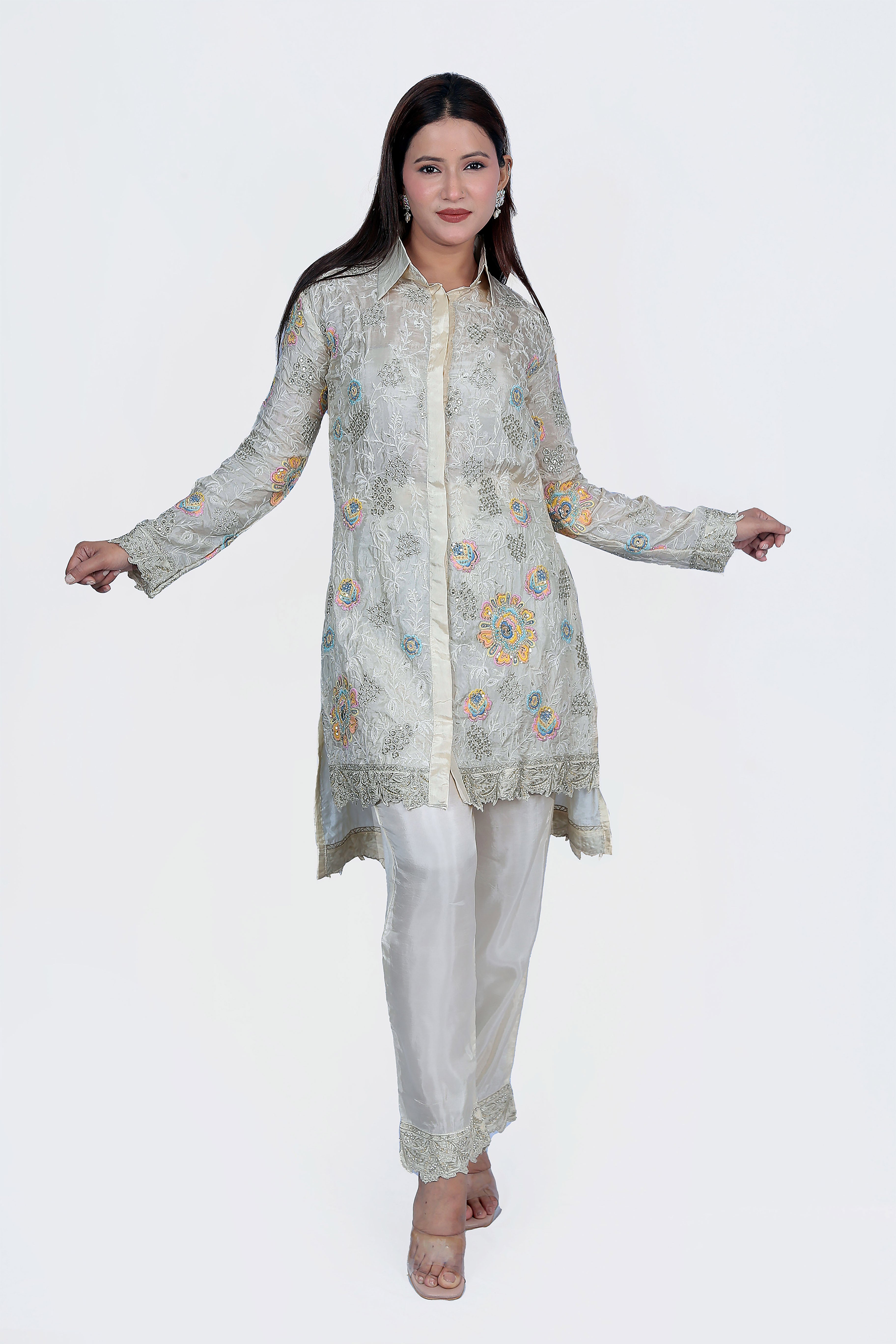 The embroidery is big multicolored flowers for contrast effect