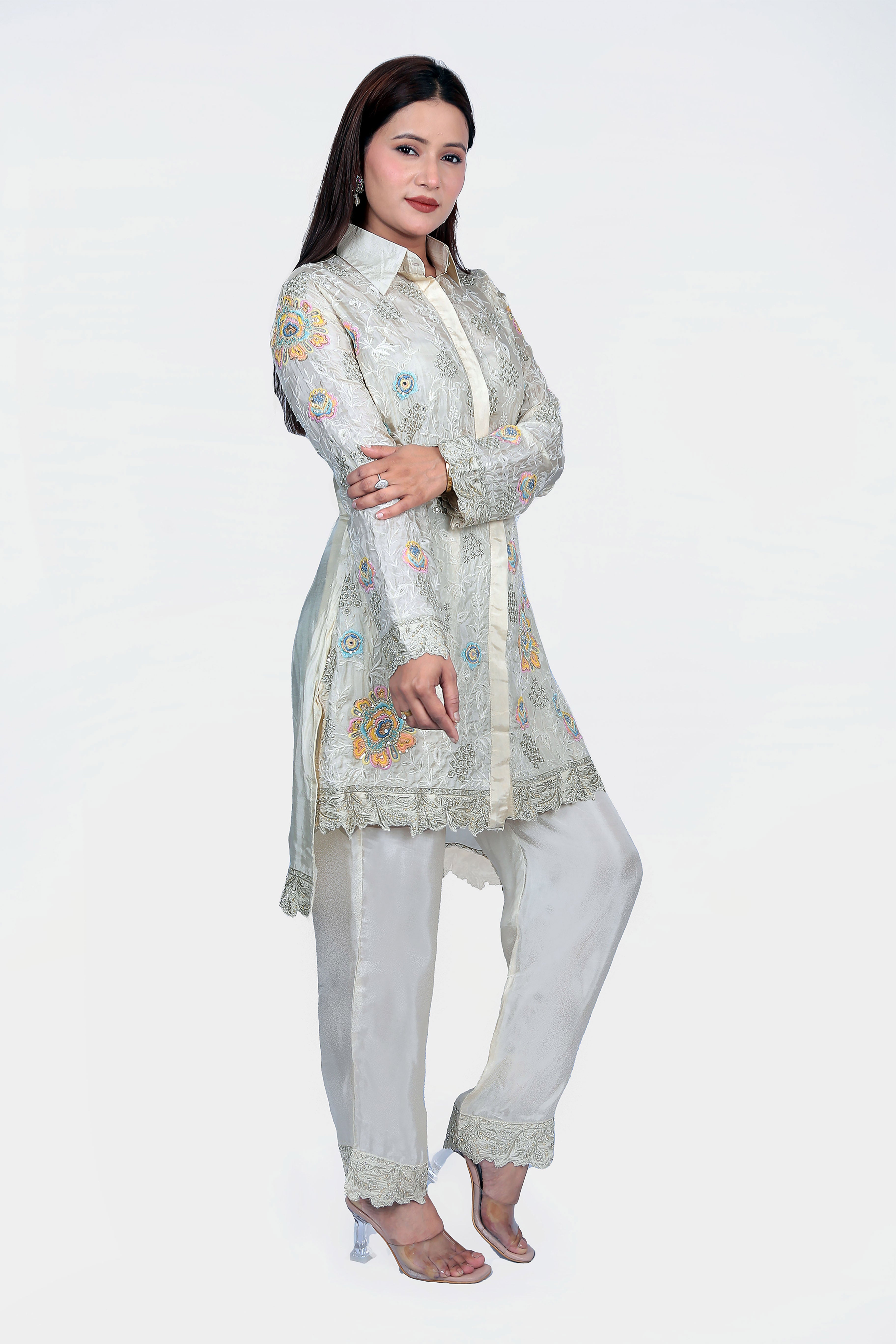 Handwoven fabric with shirt style top and bottom pants.