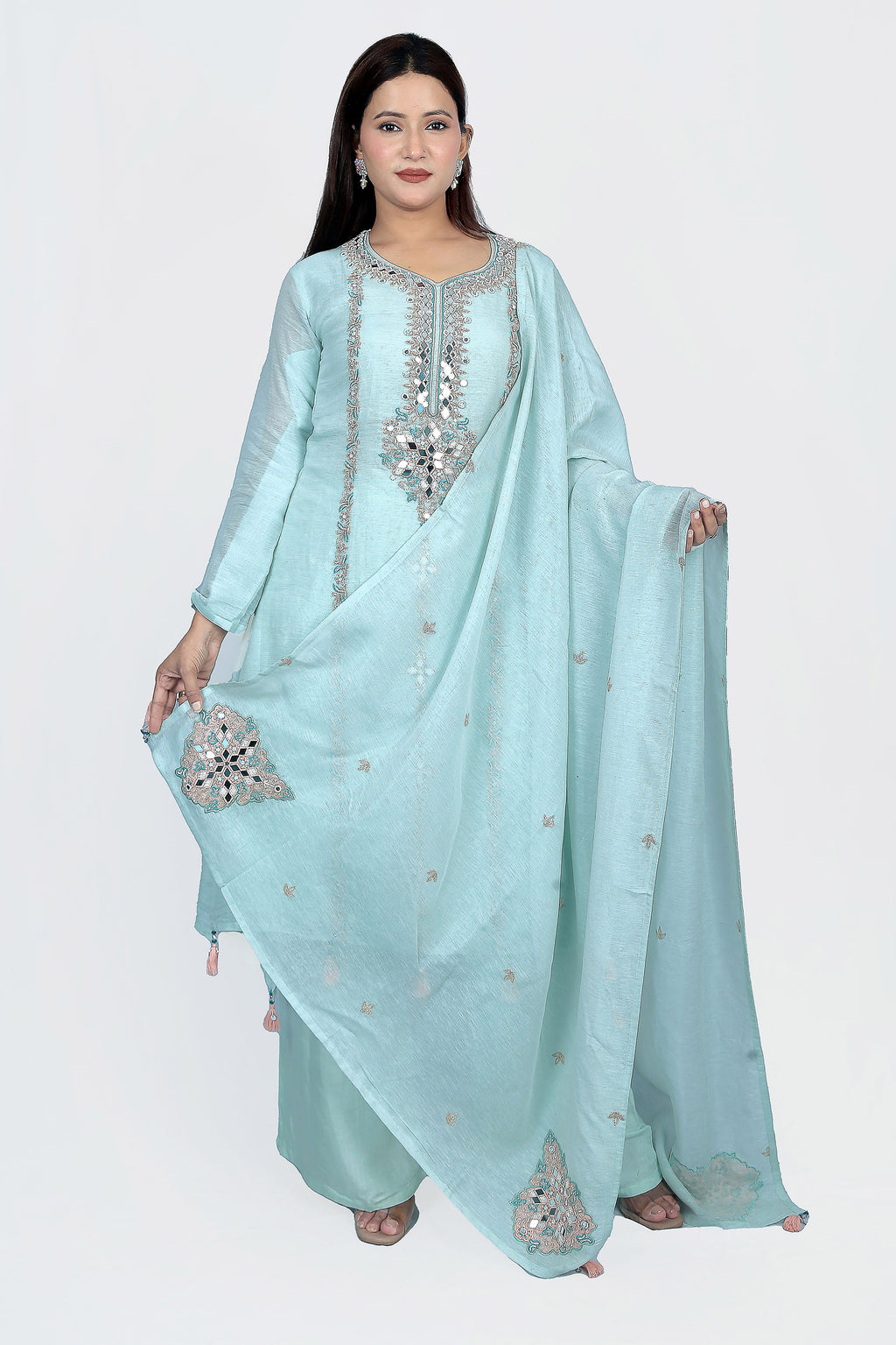 This suit set is designed with exclusive white pearl work that adds shimmer to a vibrant mirror work.