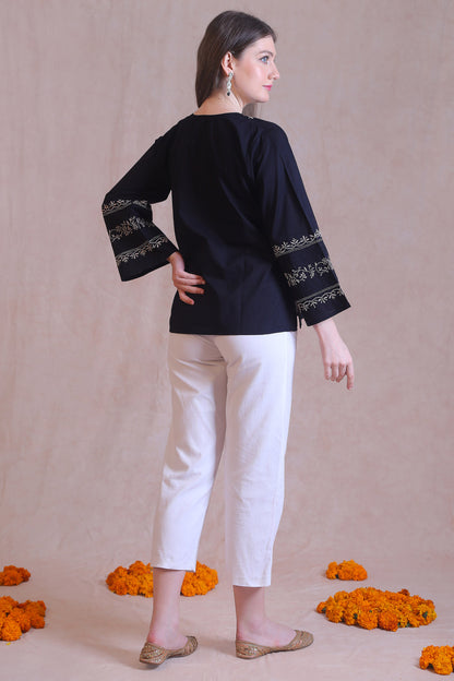 Handcrafted embroidery adds a unique and sophisticated touch.