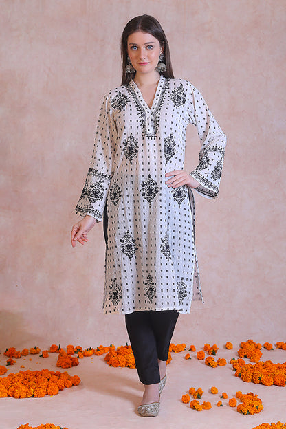 A timeless color palette and pretty embroidery