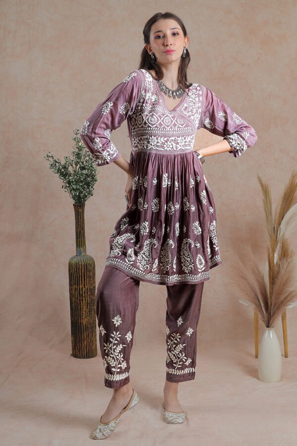 Asymmetrical yoke frock style muslin kurta with pants offers a perfect blend of modern style and traditional charm.