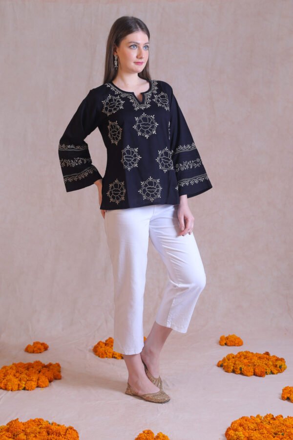 Black Kurti with beige embroidery all over.